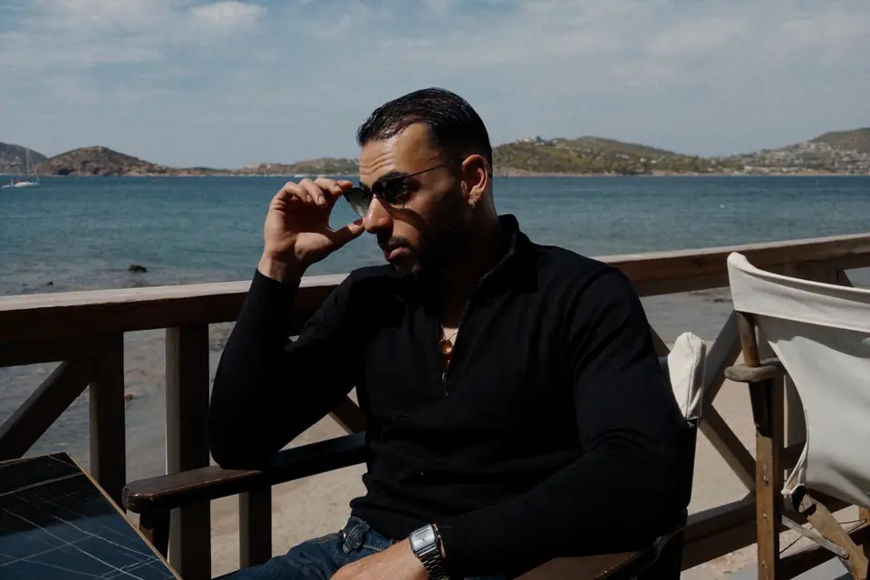 Roei Shirav on a terrace above the sea in Greece.